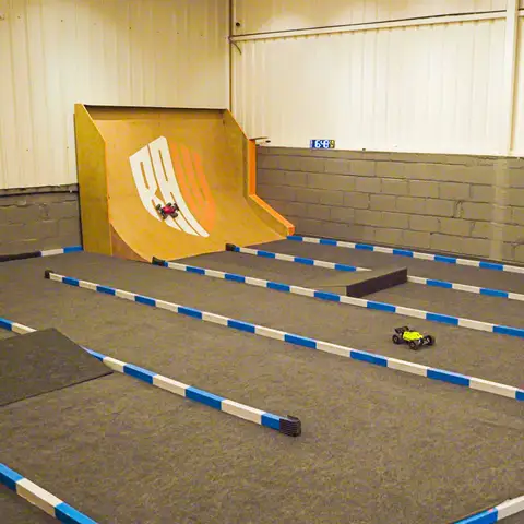Race at a pro track with sharp curves, ramps, and dynamic planks.